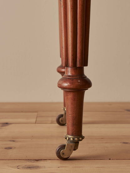 Victorian mahogany writing table with reeded legs