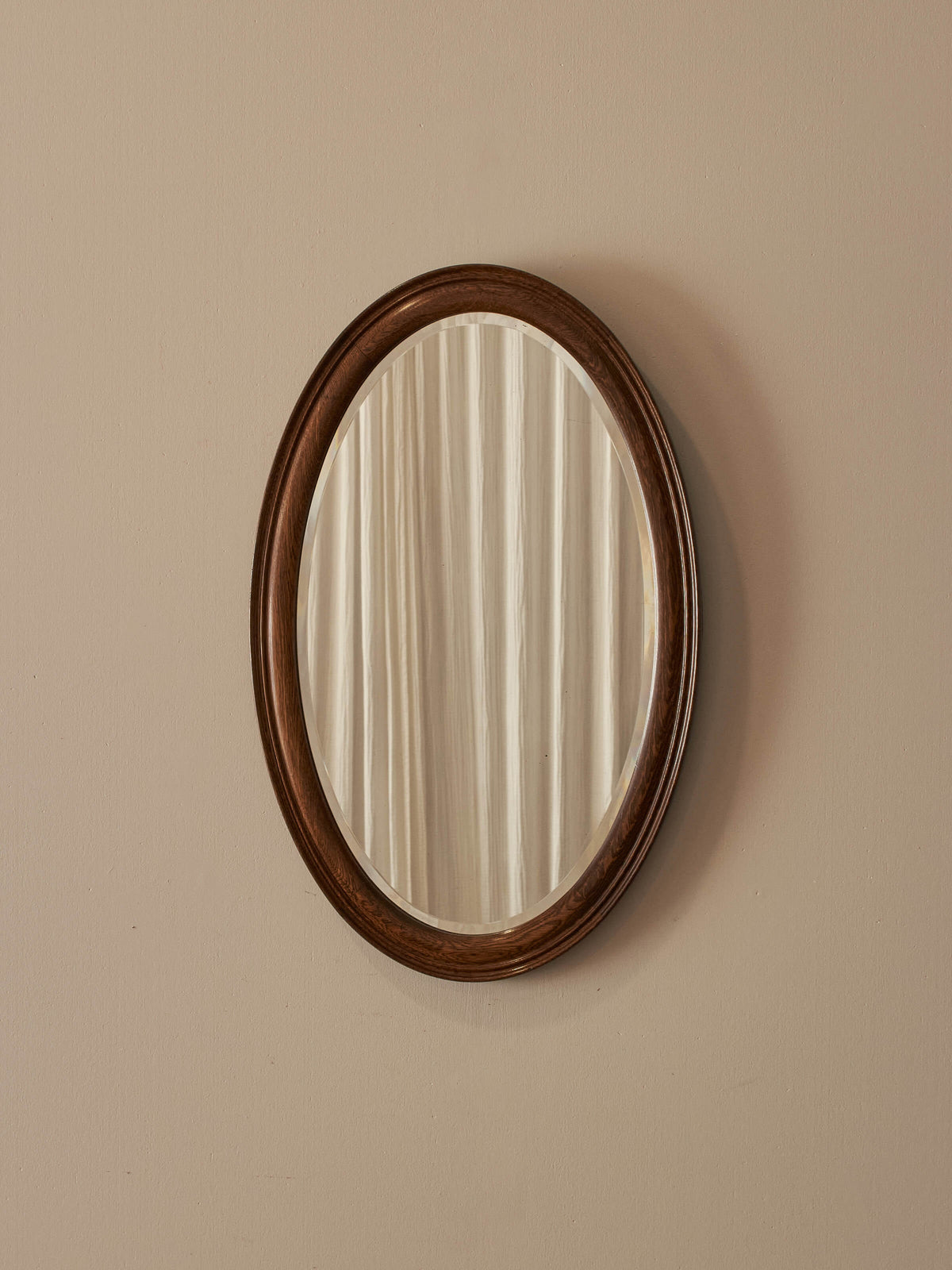 Antique oval oak bevelled mirror