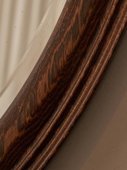 Antique oval oak bevelled mirror