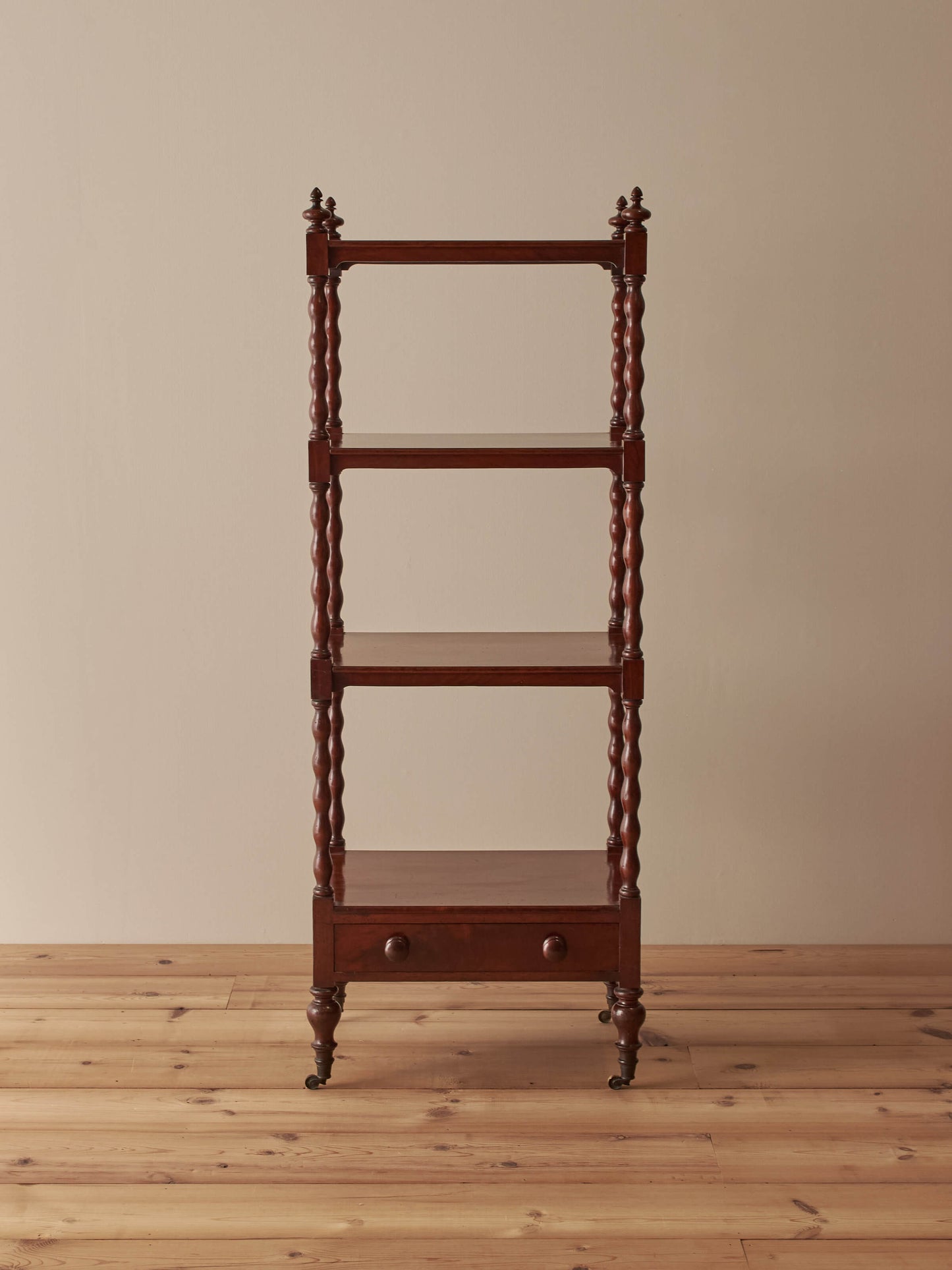 Victorian mahogany bobbin whatnot on castors