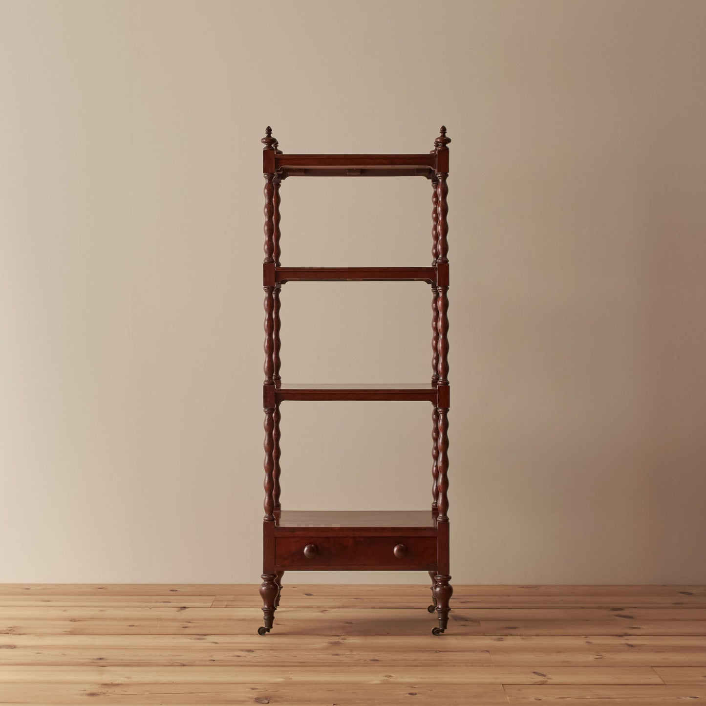 Victorian mahogany bobbin whatnot on castors