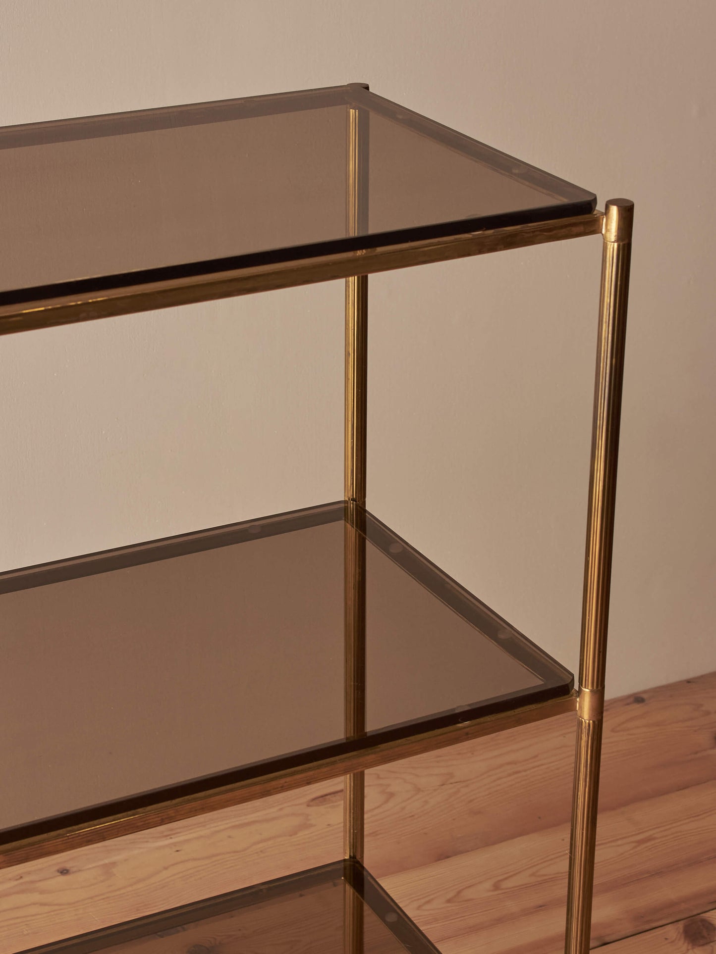 Mid-century brass and smoked glass shelving unit