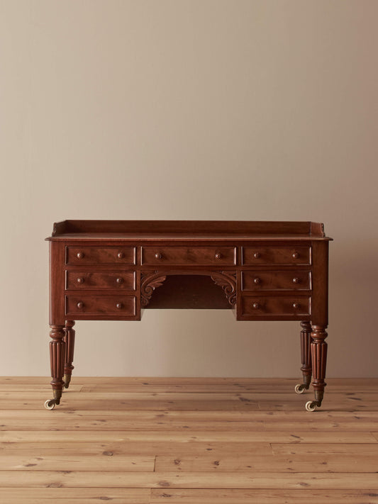 Victorian mahogany desk on castors by T.H.Filmer
