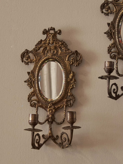 Pair of French antique mirrored brass candle sconces