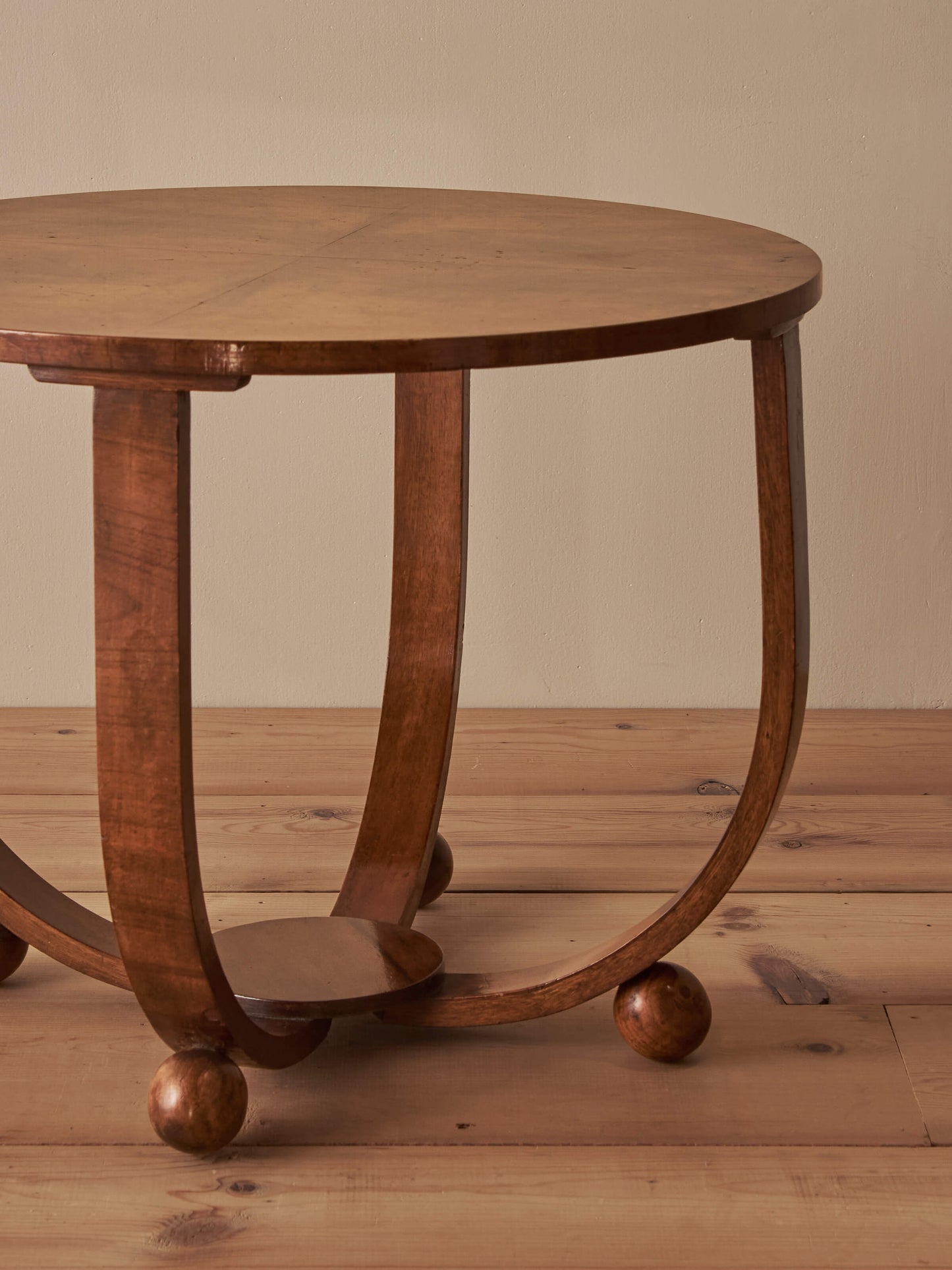 Art Deco walnut circular side table on ball feet