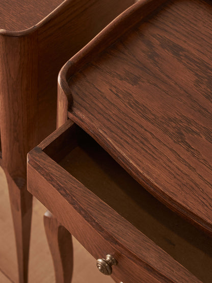 Close-pair of vintage French oak bedside tables