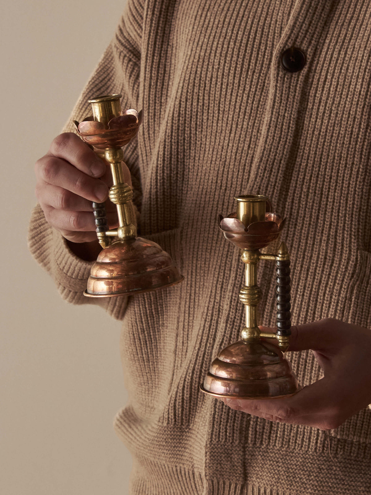 A pair of Arts and Crafts candlesticks by Christopher Dresser