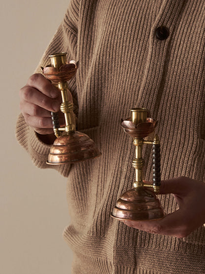 A pair of Arts and Crafts candlesticks by Christopher Dresser