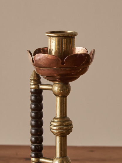 A pair of Arts and Crafts candlesticks by Christopher Dresser