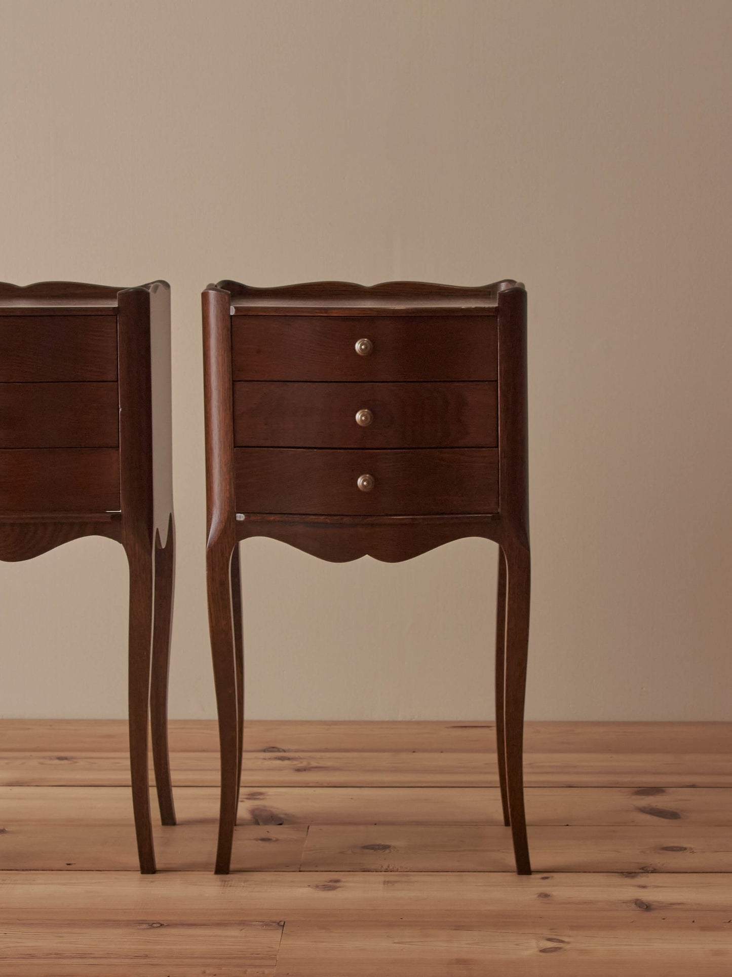 Pair of French mid-century bedside tables with three drawers