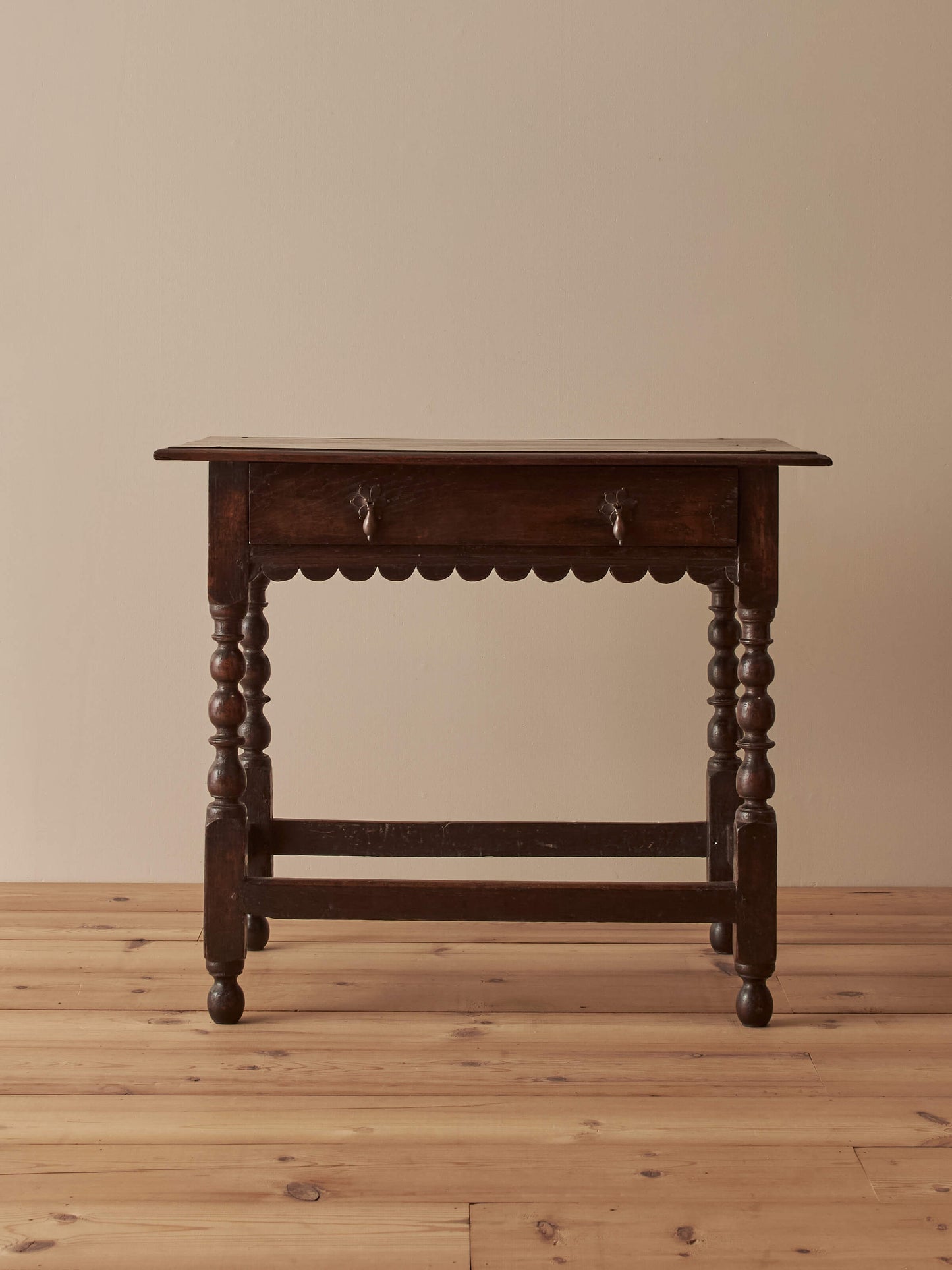 Early 18th century side table with scalloped apron