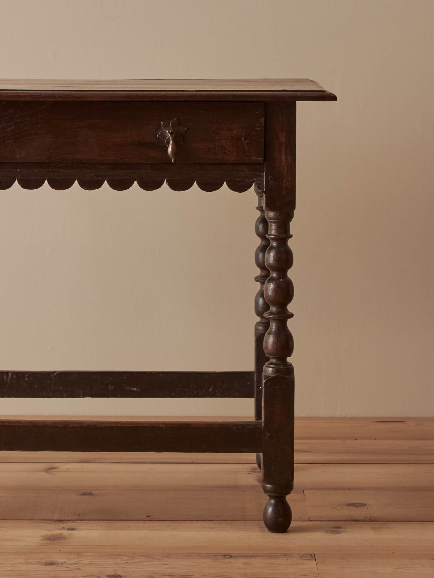 Early 18th century side table with scalloped apron