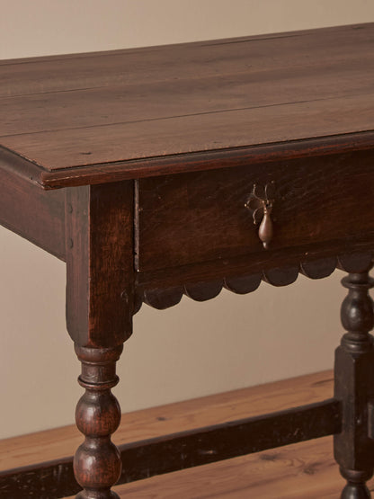 Early 18th century side table with scalloped apron