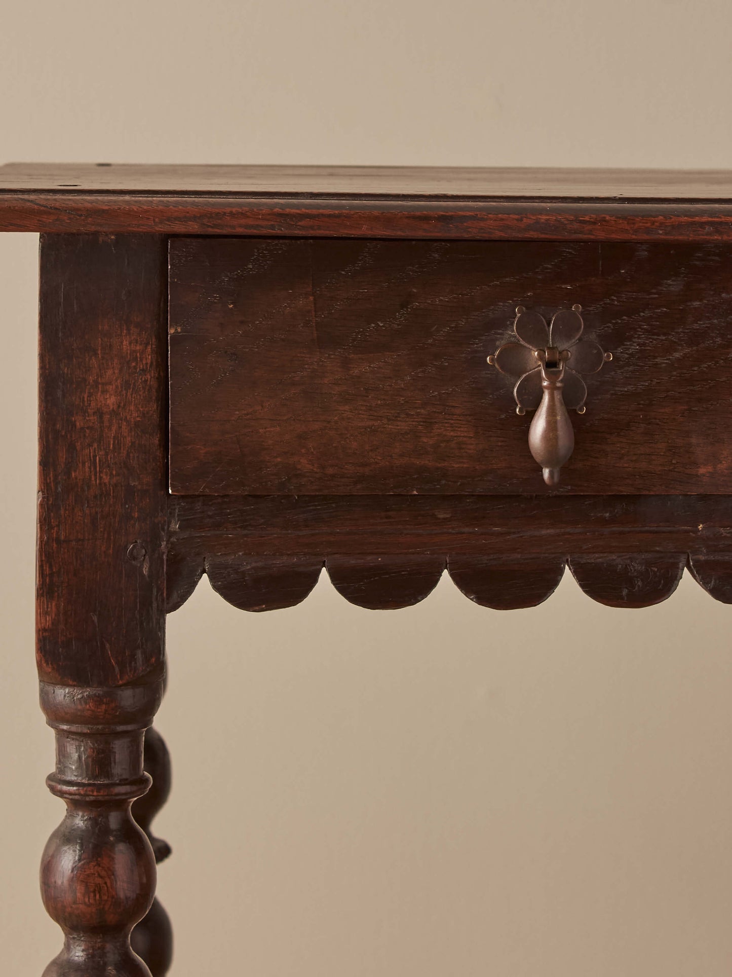 Early 18th century side table with scalloped apron