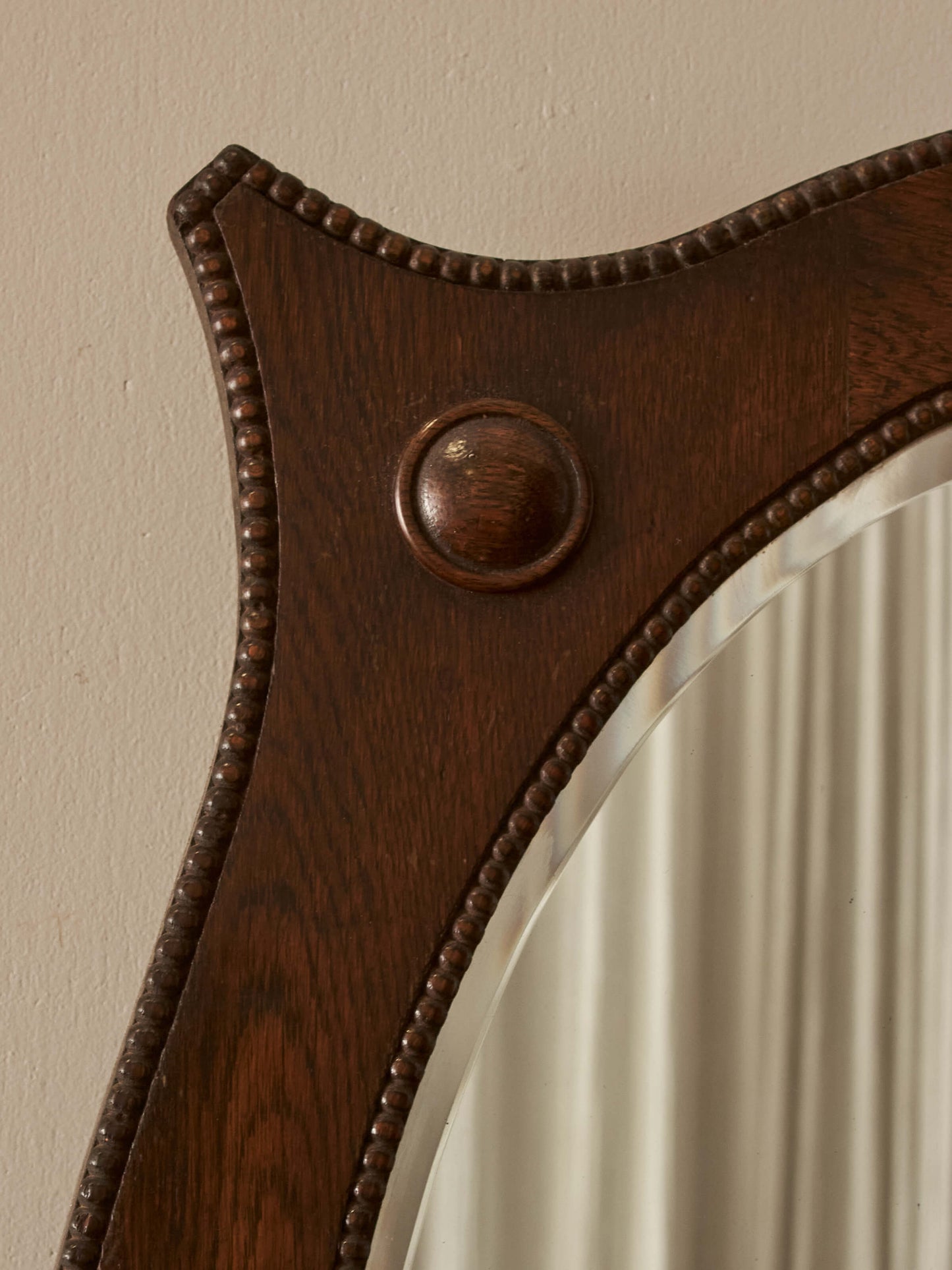 Edwardian oval oak mirror with bobbin detailing