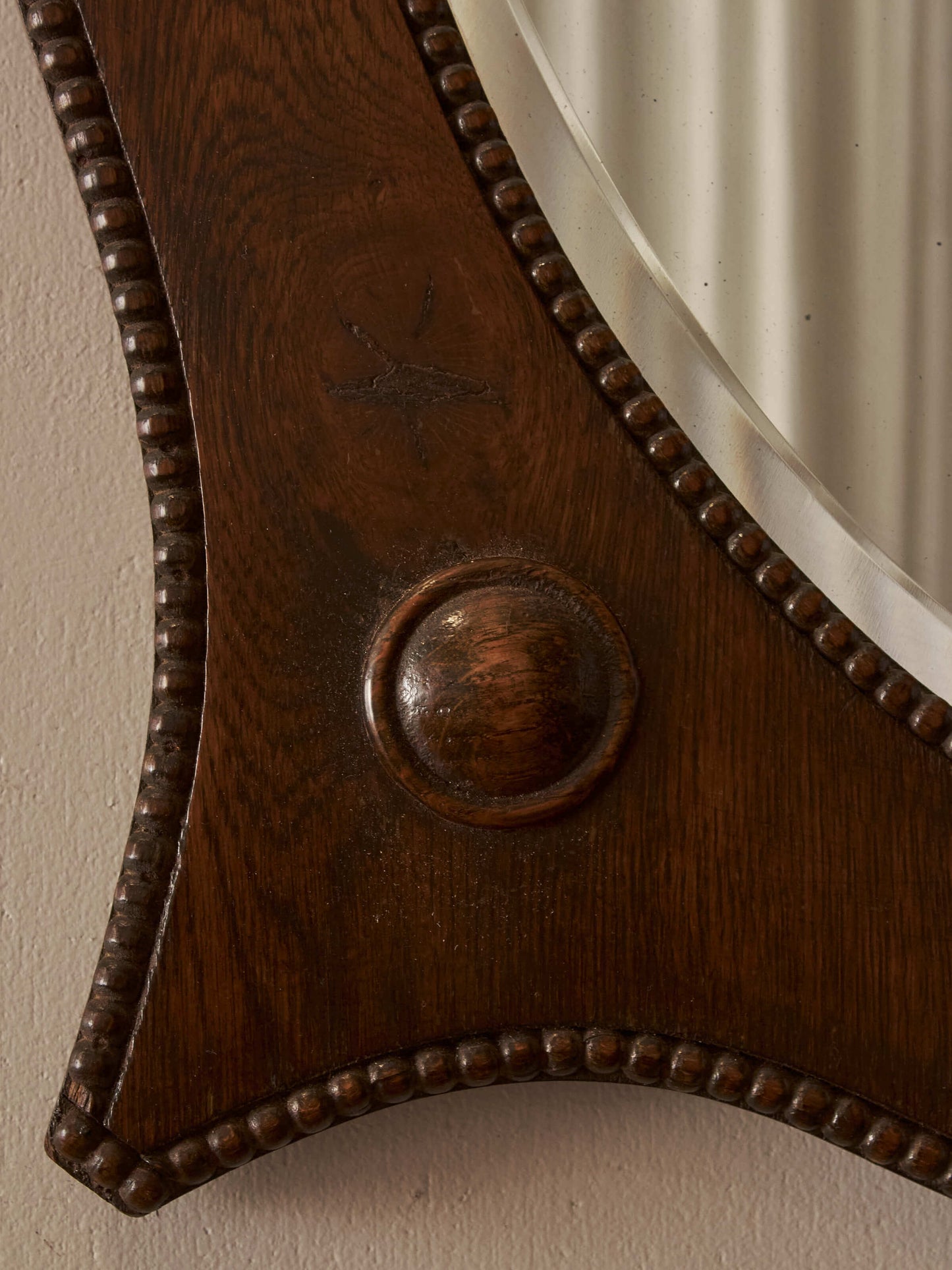 Edwardian oval oak mirror with bobbin detailing