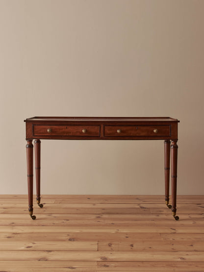 Regency mahogany desk on brass castors