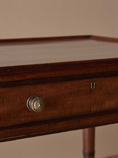 Regency mahogany desk on brass castors