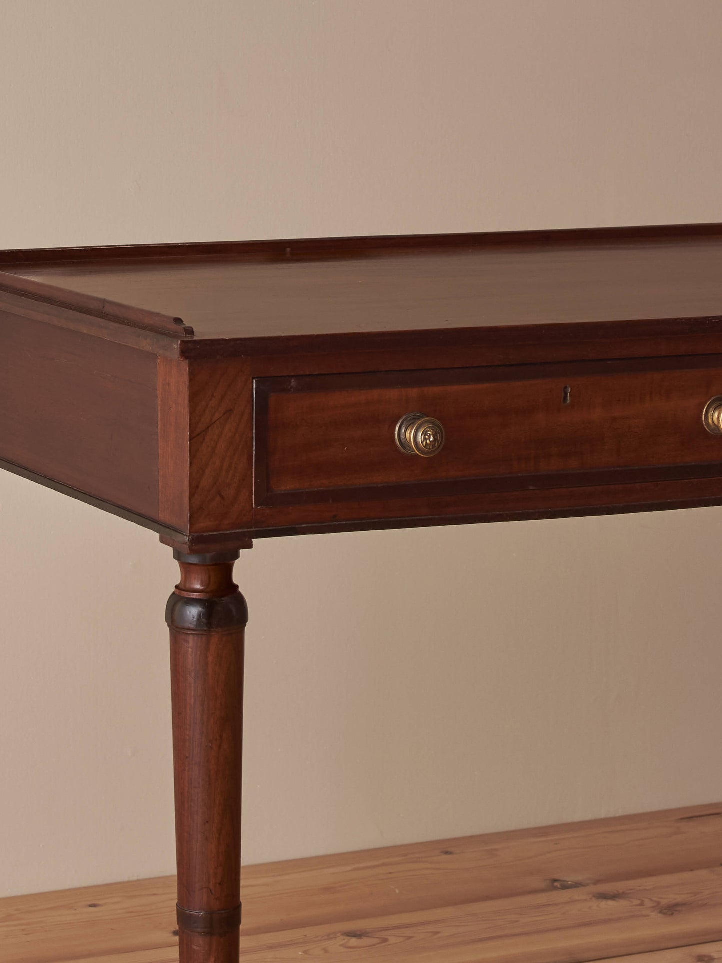 Regency mahogany desk on brass castors