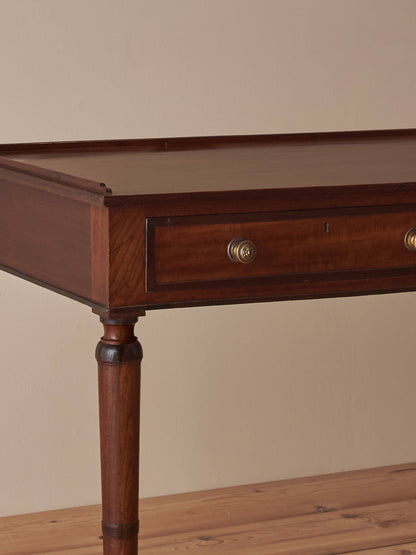 Regency mahogany desk on brass castors