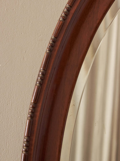 Antique oval walnut mirror with bobbin detailing