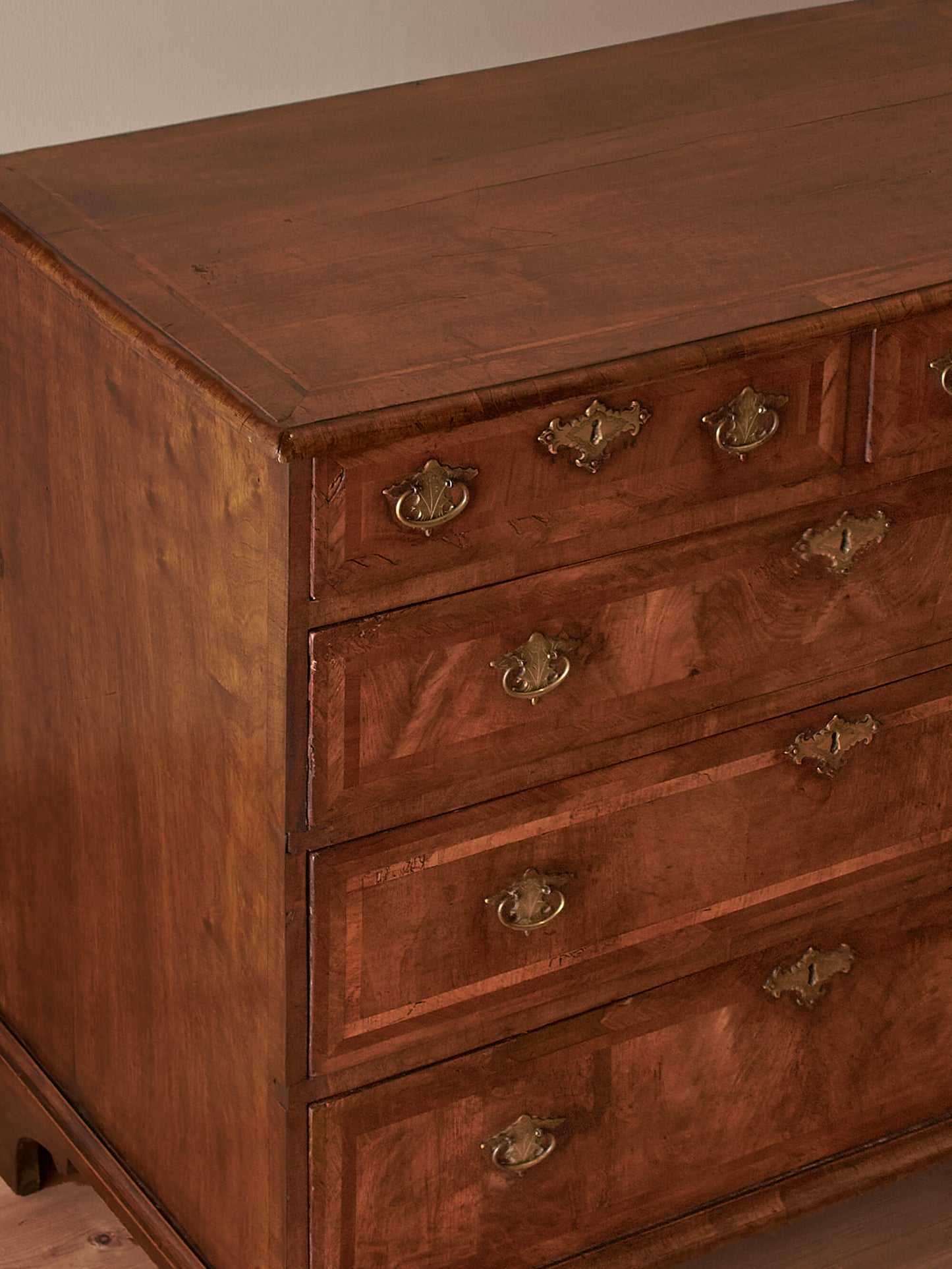 George I walnut cross-banded chest of drawers