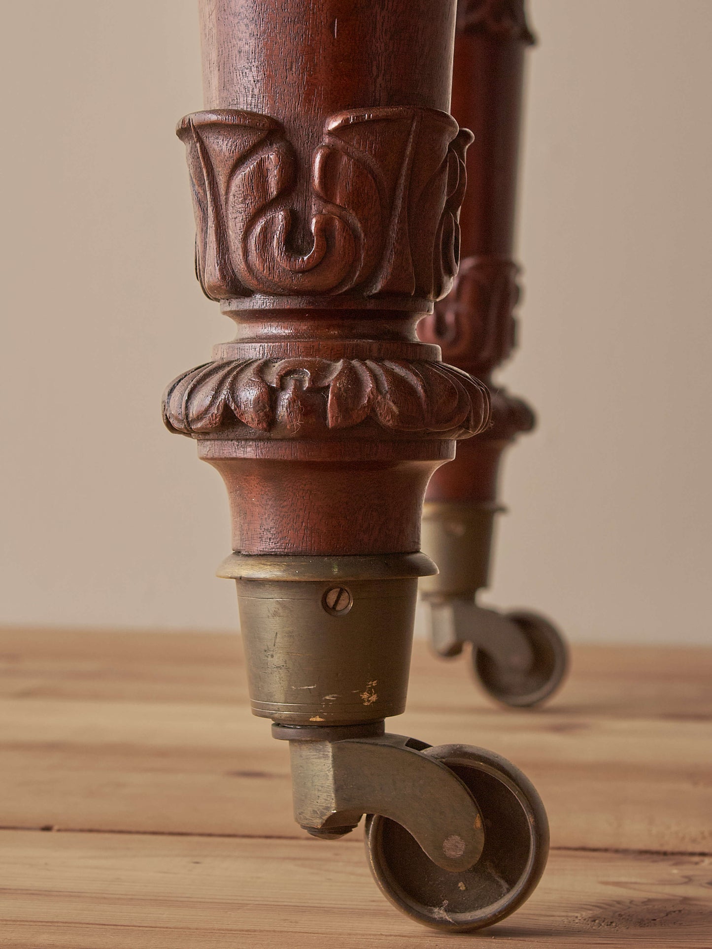 Antique William IV mahogany dining table on brass castors