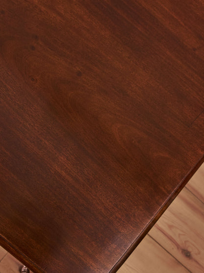 Antique William IV mahogany dining table on brass castors