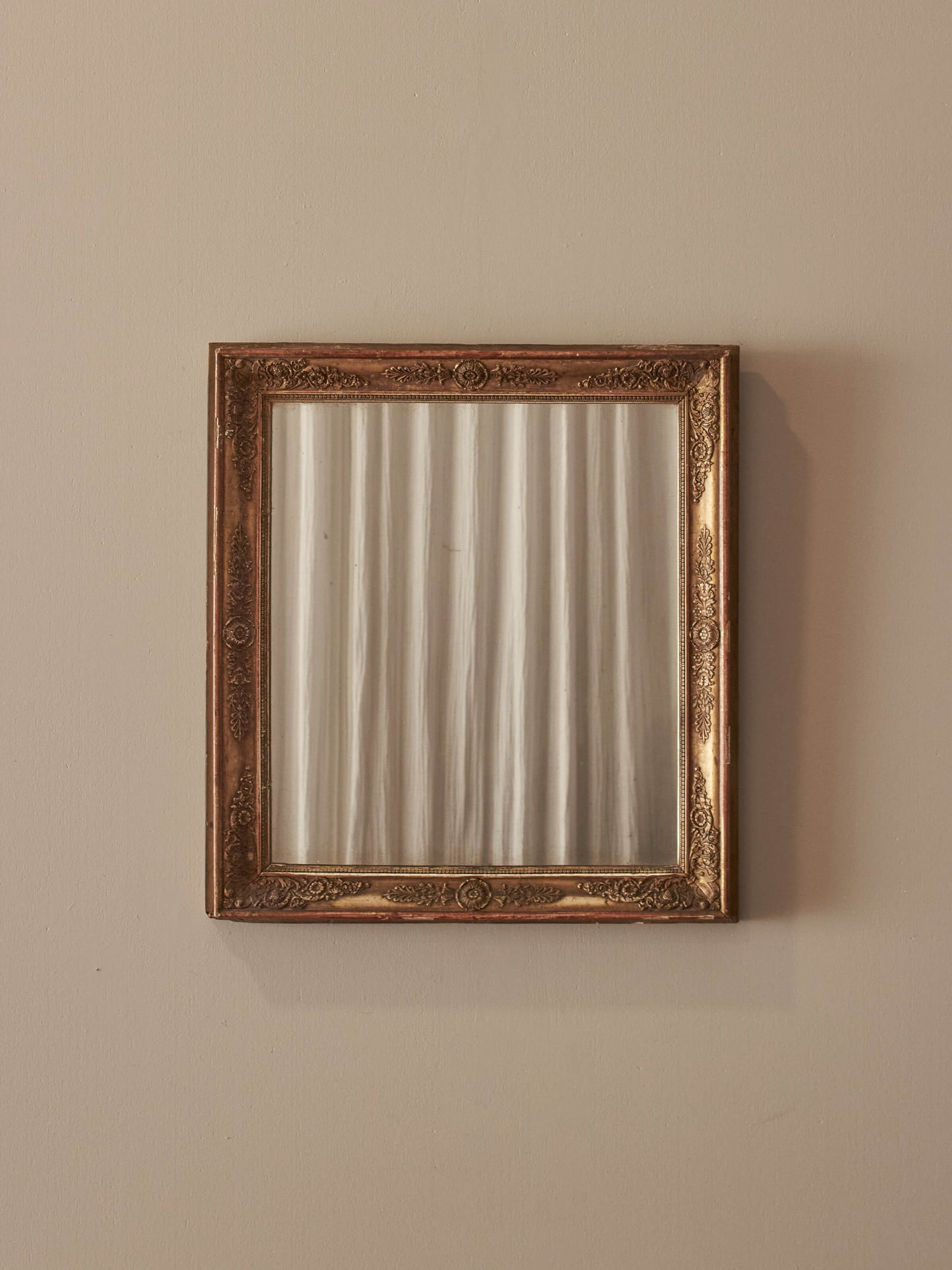 French antique gilt mirror with floral motifs