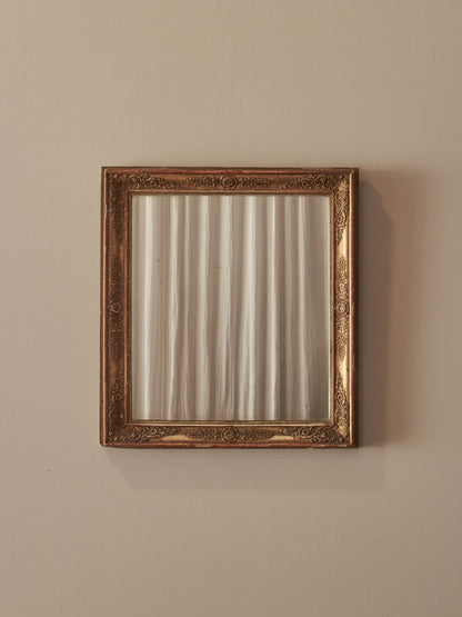 French antique gilt mirror with floral motifs