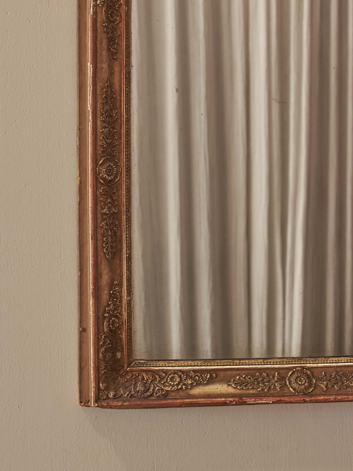 French antique gilt mirror with floral motifs