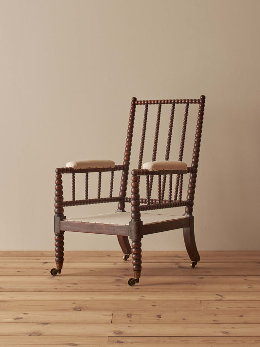 Victorian bobbin armchair raised on castors