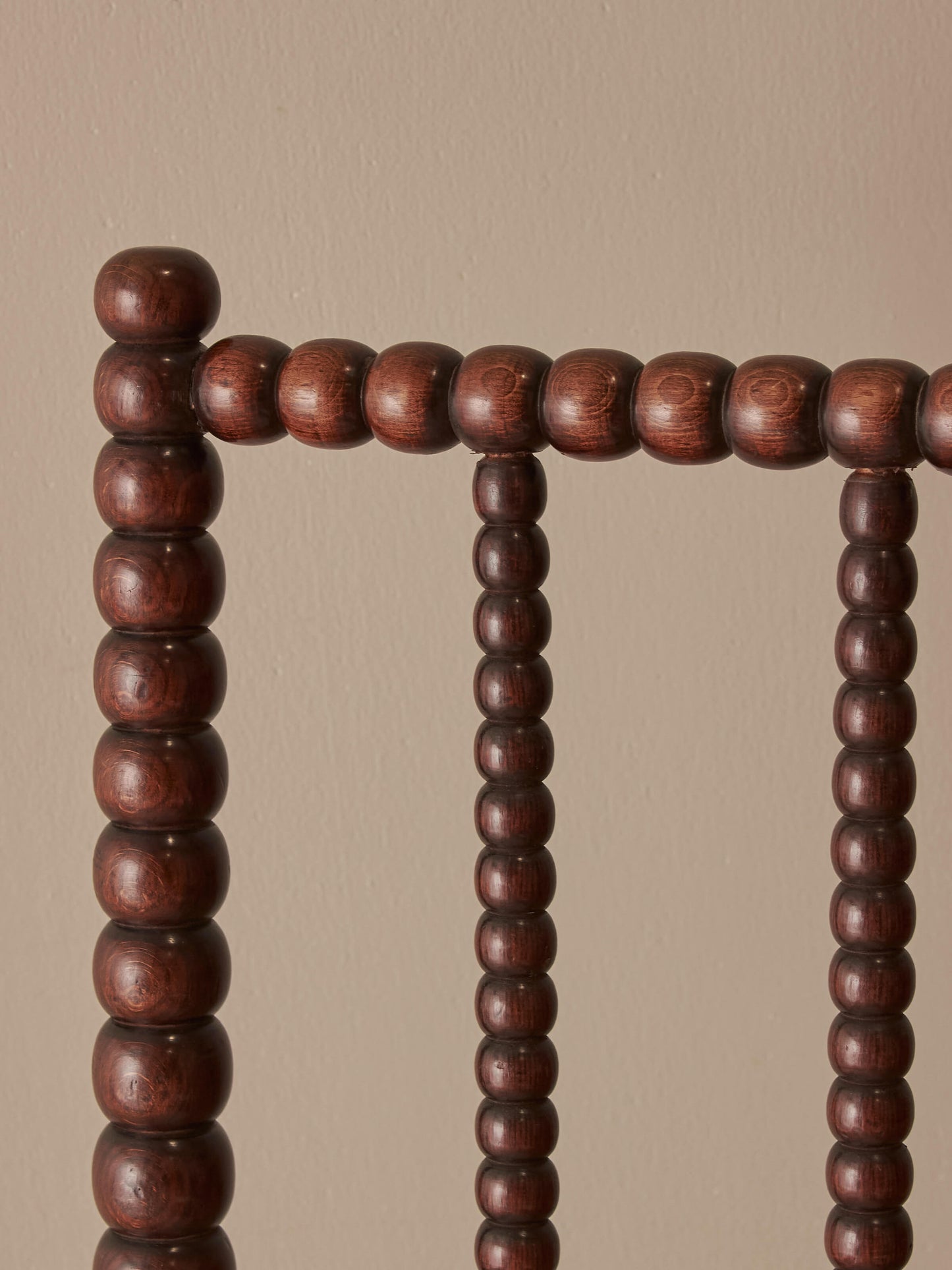Victorian bobbin armchair raised on castors