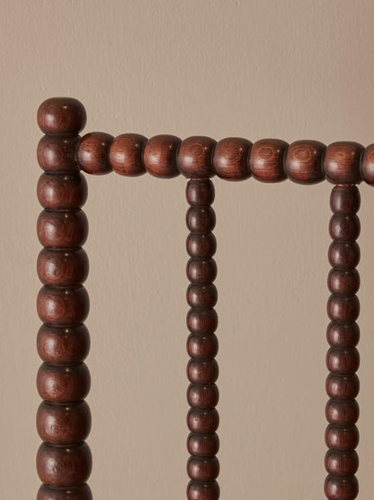 Victorian bobbin armchair raised on castors