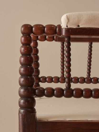 Victorian bobbin armchair raised on castors