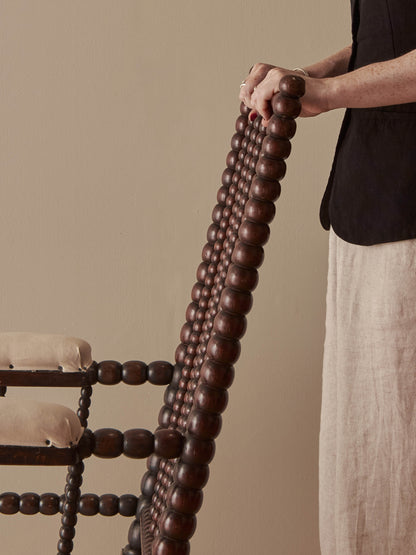 Victorian bobbin armchair raised on castors