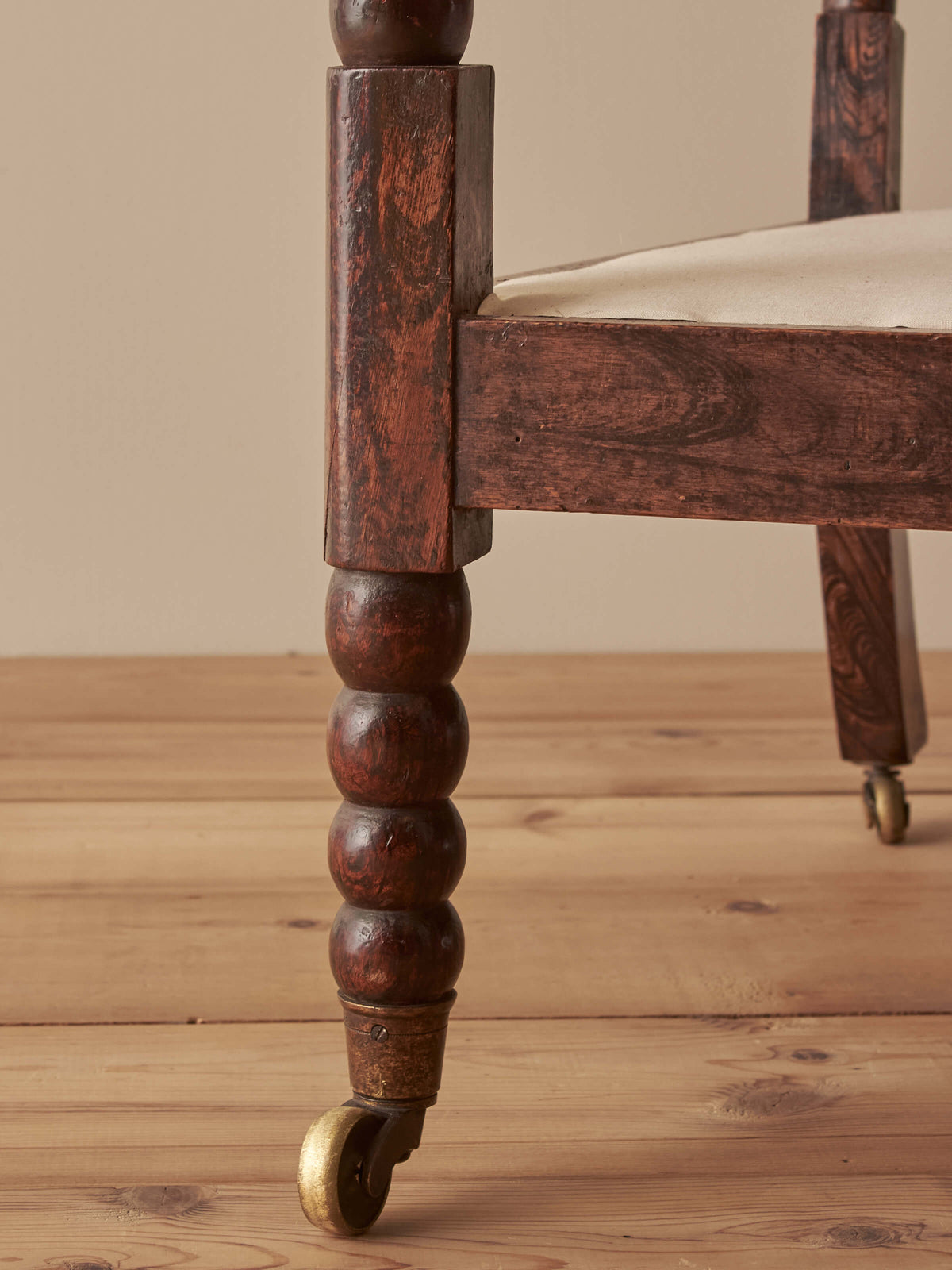 Victorian bobbin armchair raised on castors