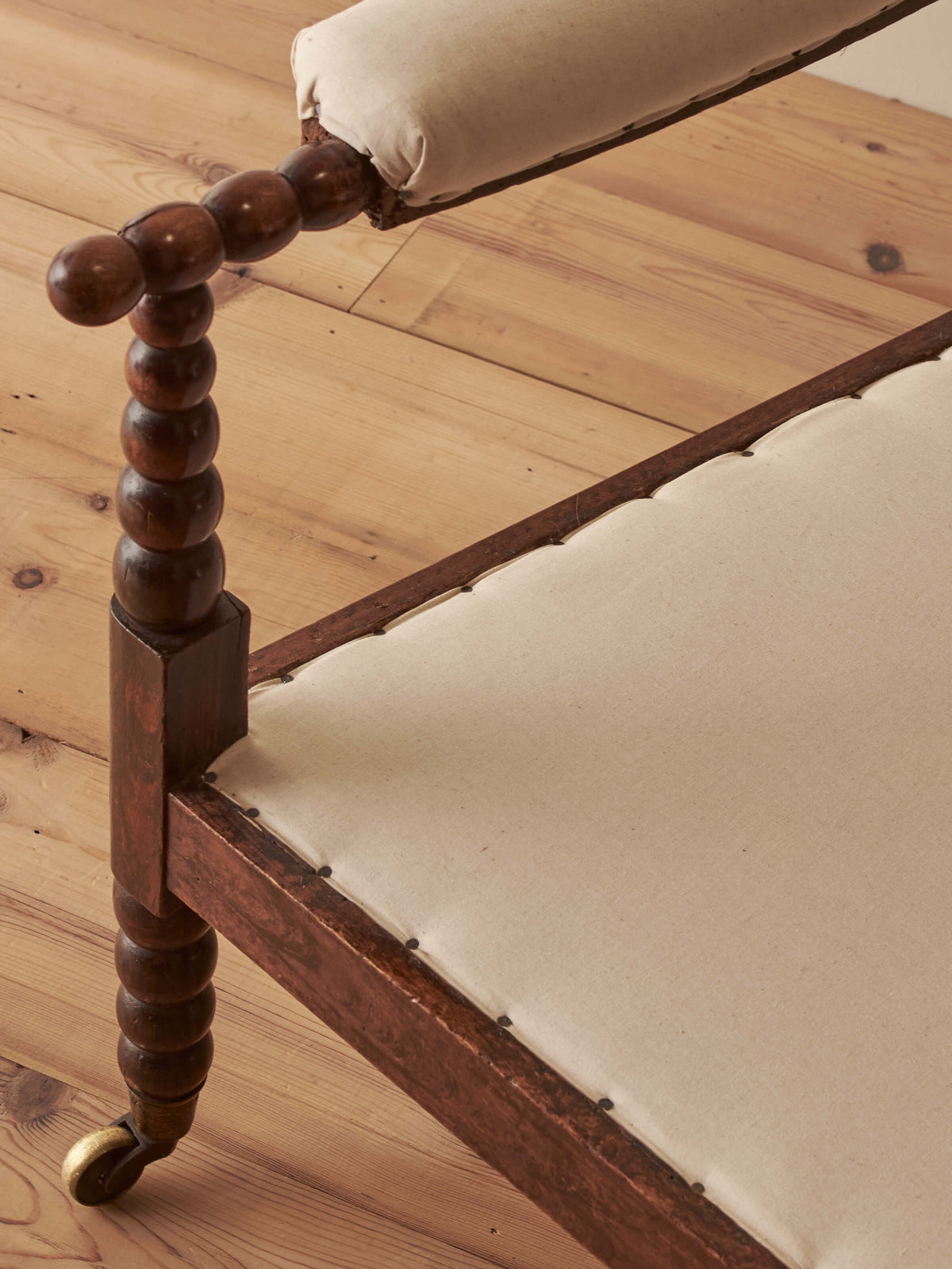 Victorian bobbin armchair raised on castors