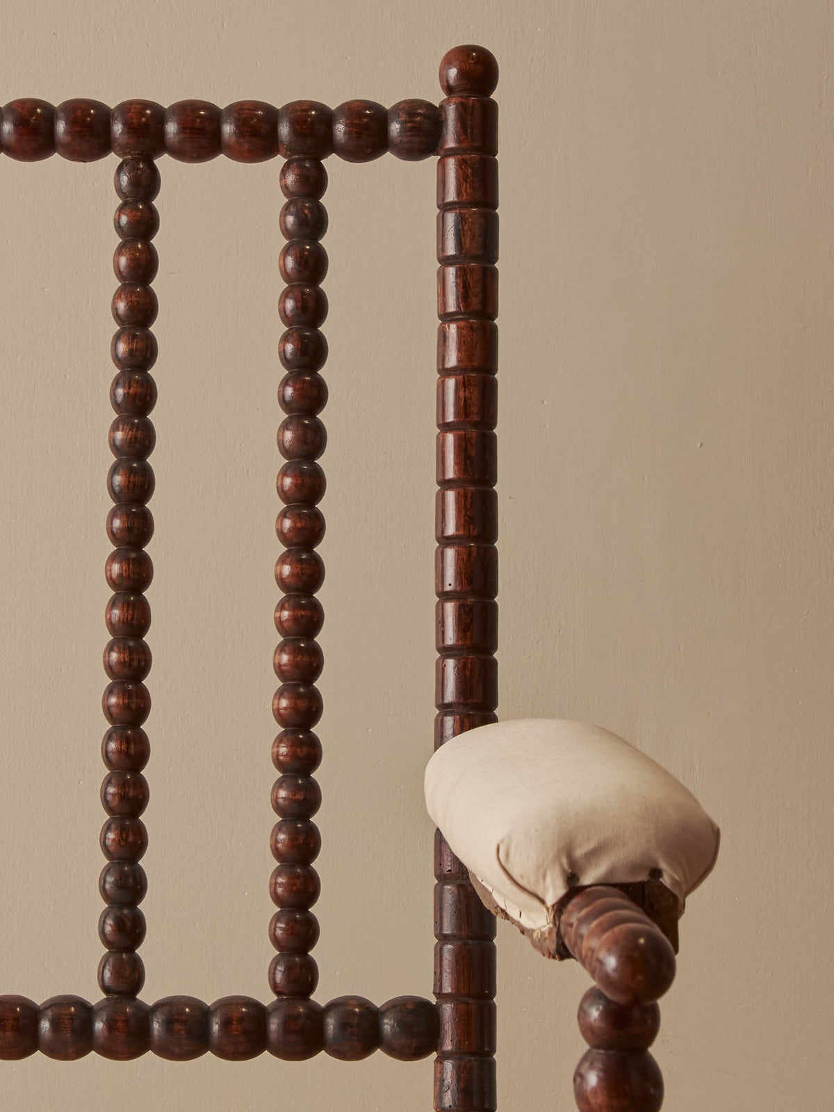 Victorian bobbin armchair raised on castors