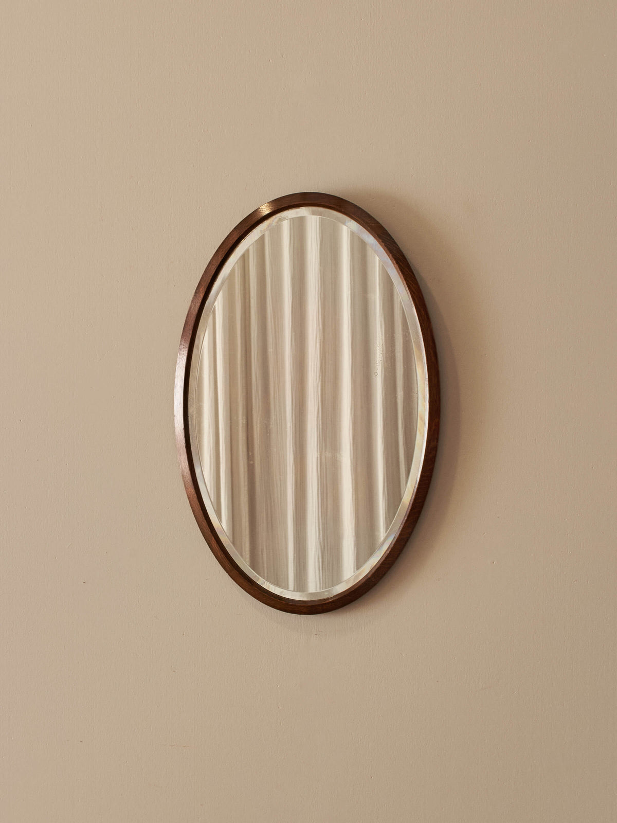 Antique oval oak bevelled mirror