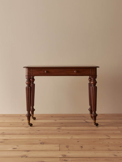 Early Victorian mahogany writing table with fluted legs