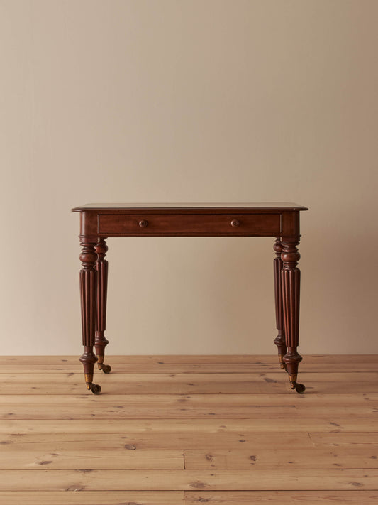 Early Victorian mahogany writing table with fluted legs