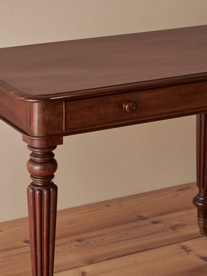 Early Victorian mahogany writing table with fluted legs