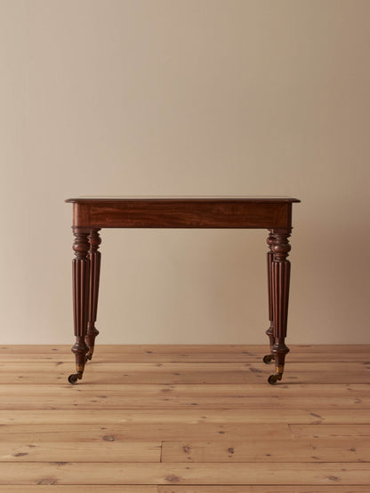 Early Victorian mahogany writing table with fluted legs