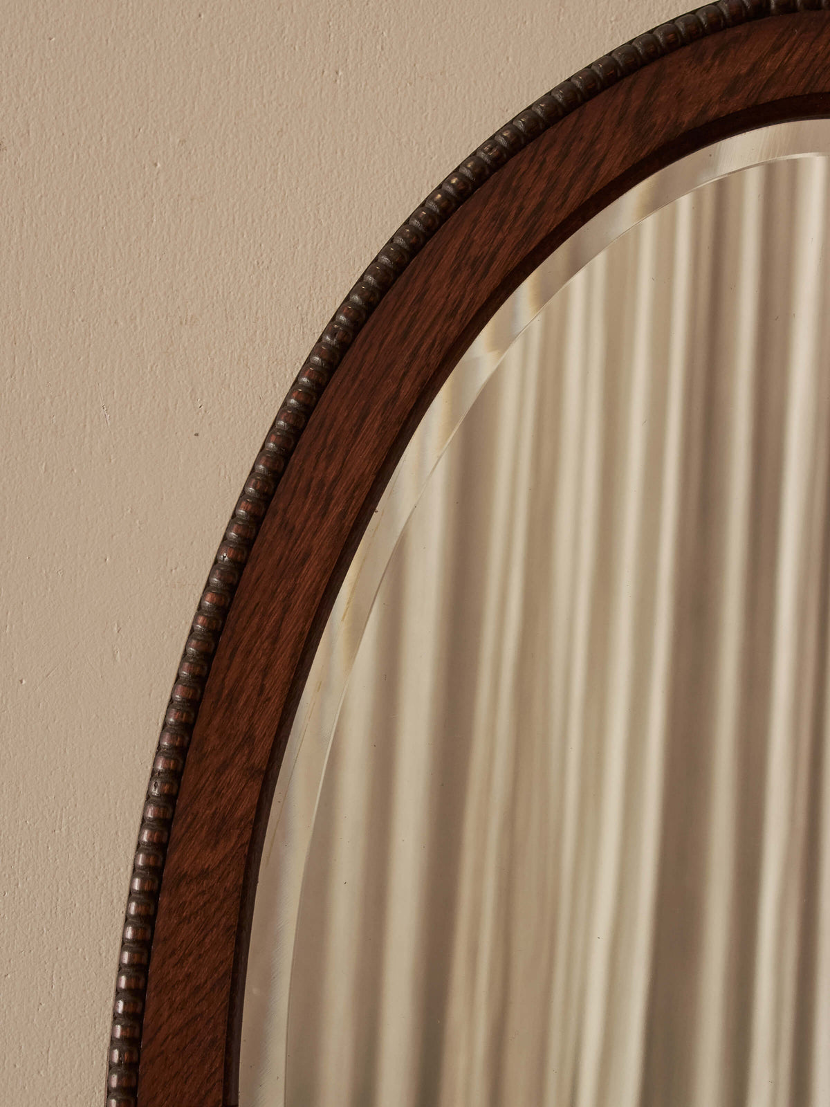 Edwardian oval oak bobbin mirror
