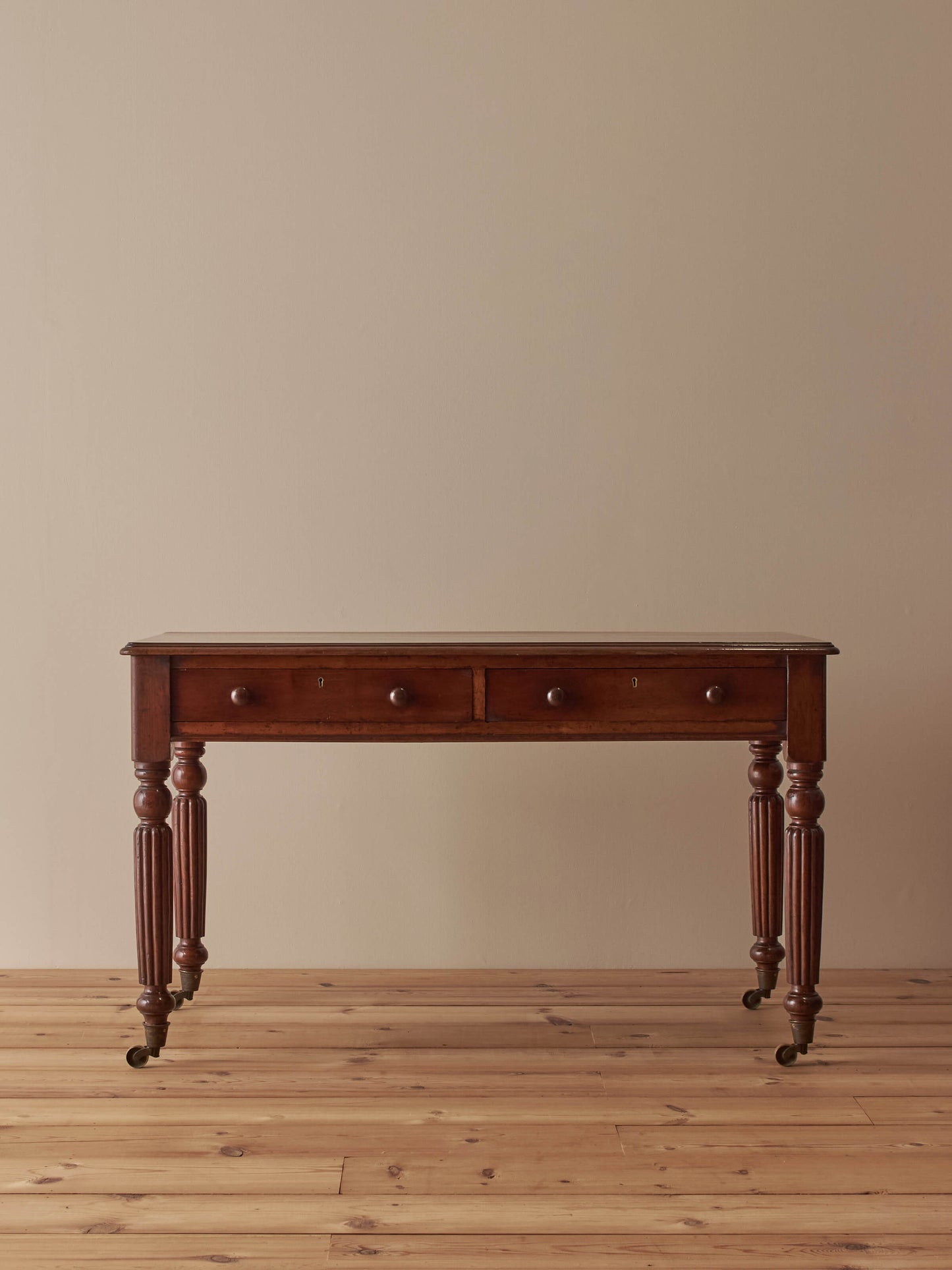 Regency mahogany desk with reeded legs