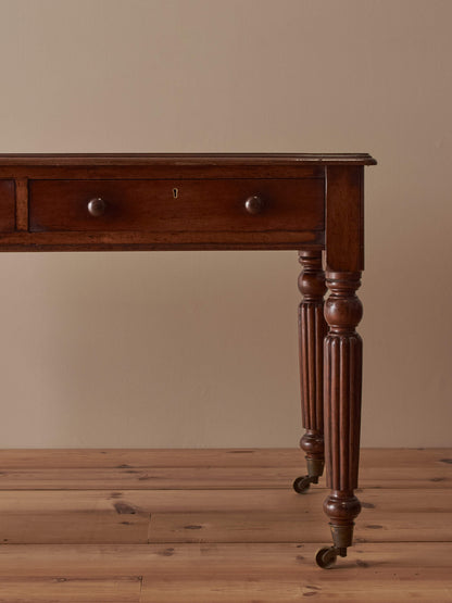 Regency mahogany desk with reeded legs