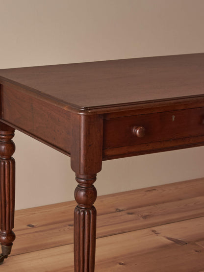 Regency mahogany desk with reeded legs