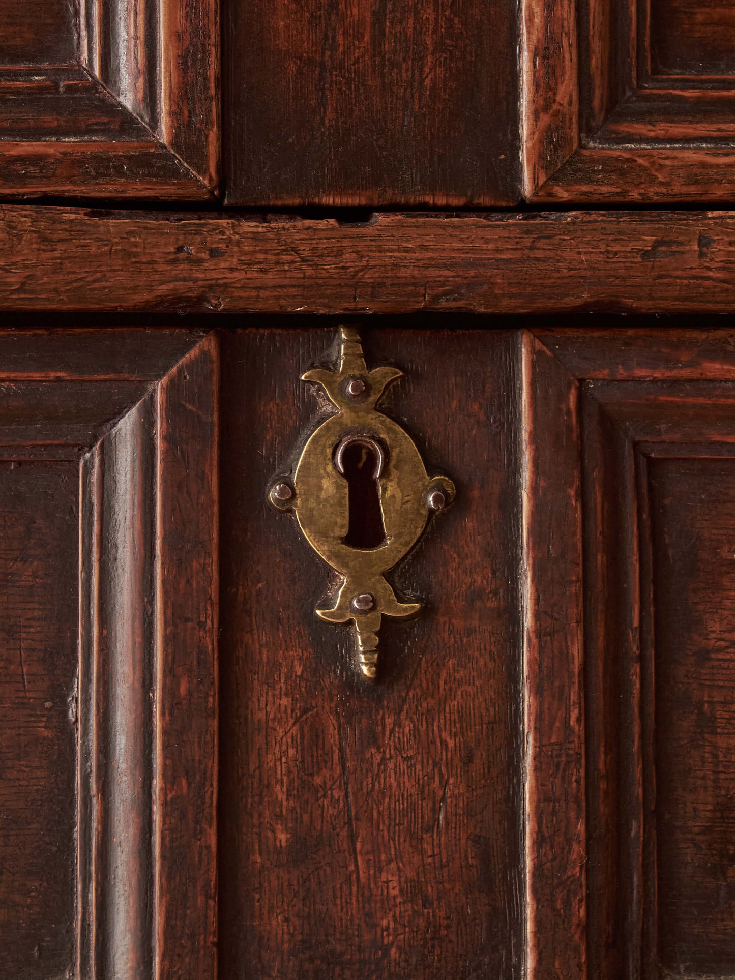 A George I oak chest of drawers on bun feet