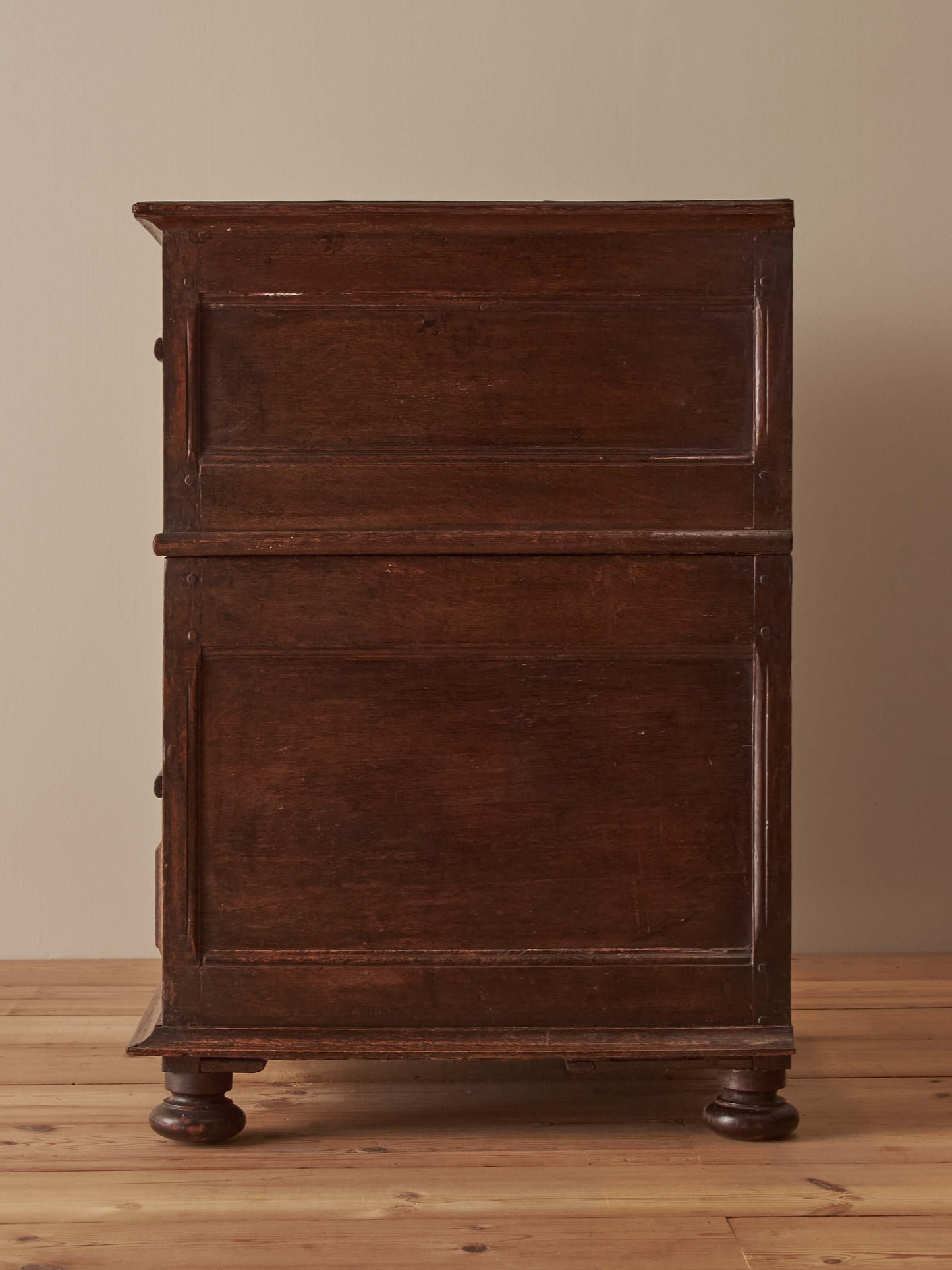 A George I oak chest of drawers on bun feet